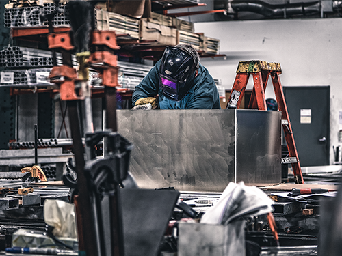 Welder working in the metal shop